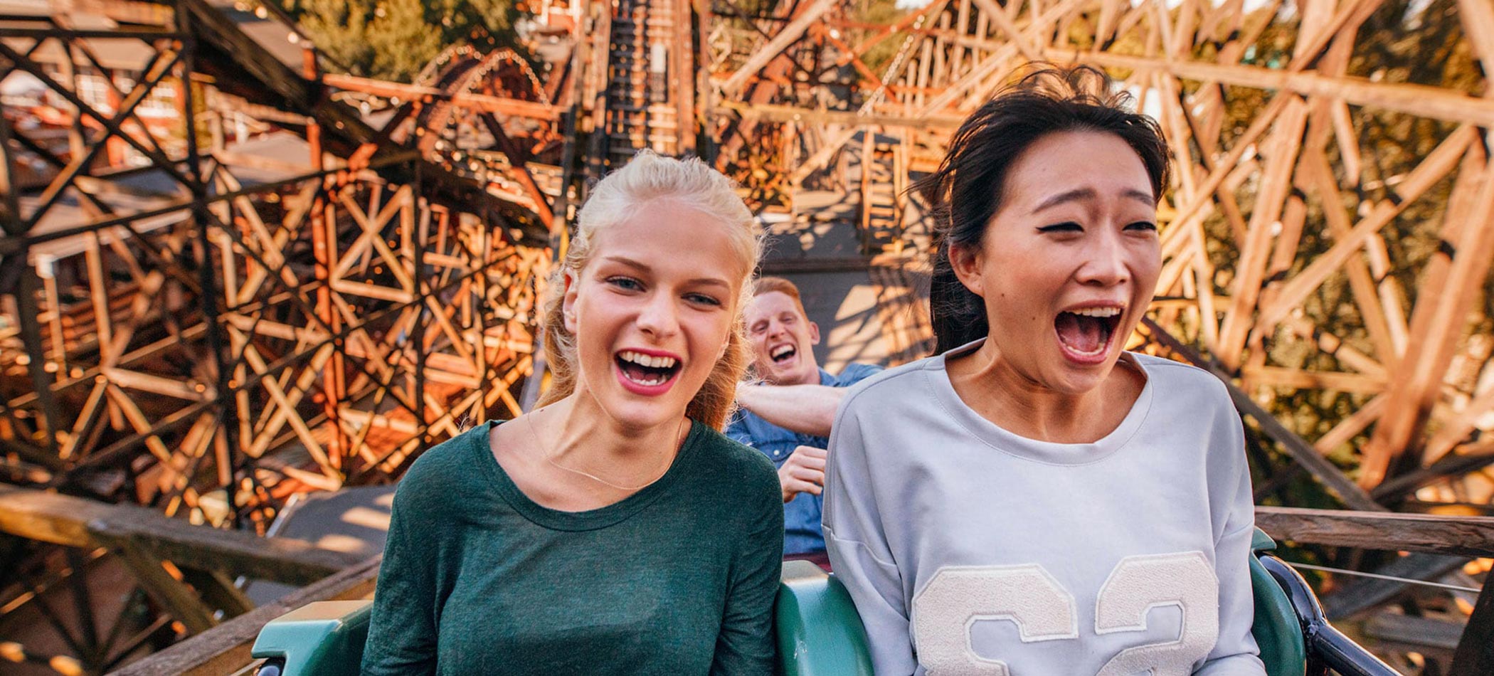 Students screaming on a ride at a theme park