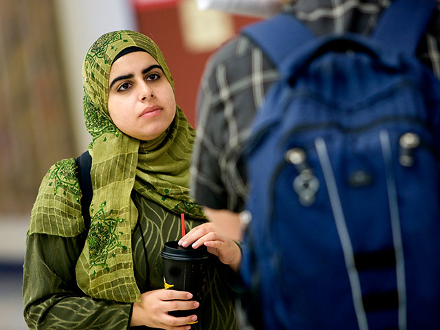 a student talking with another student