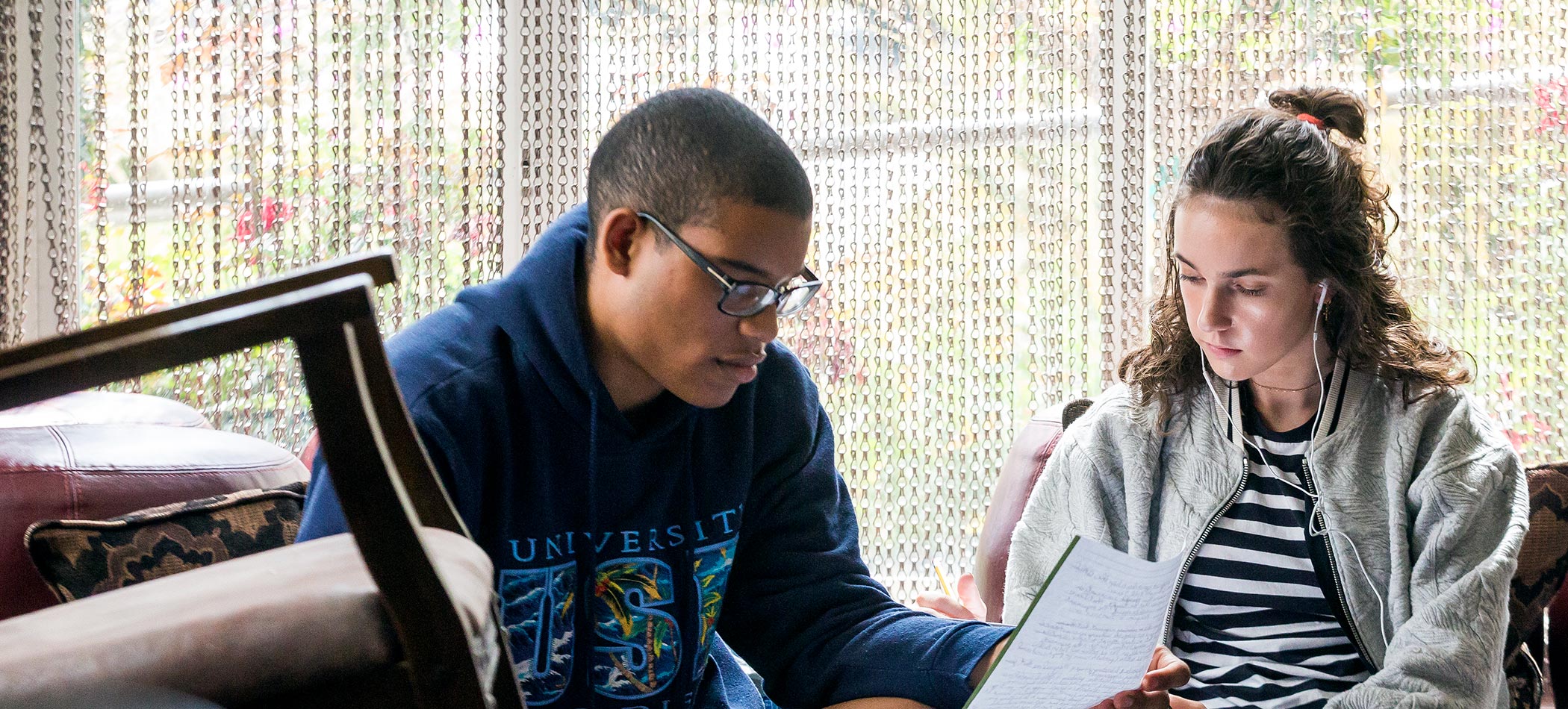 Students talking and studying together