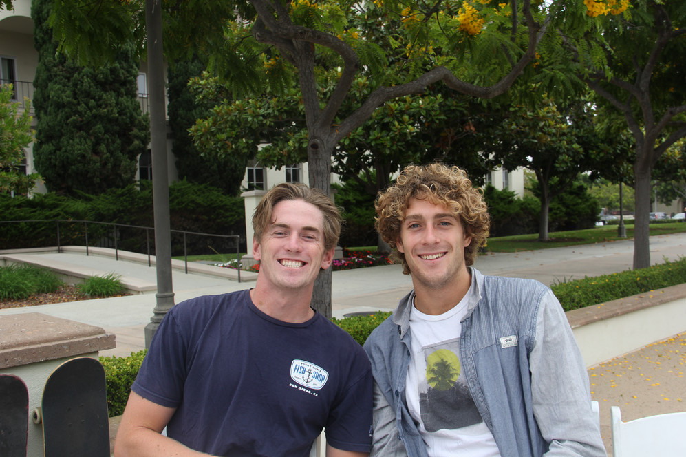 students on campus smiling at the camera