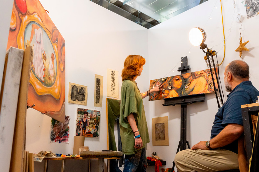 student and faculty analyzing art