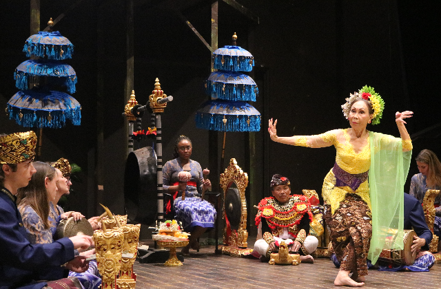 The USD gamelan ensemble musicians and dancer performing on stage