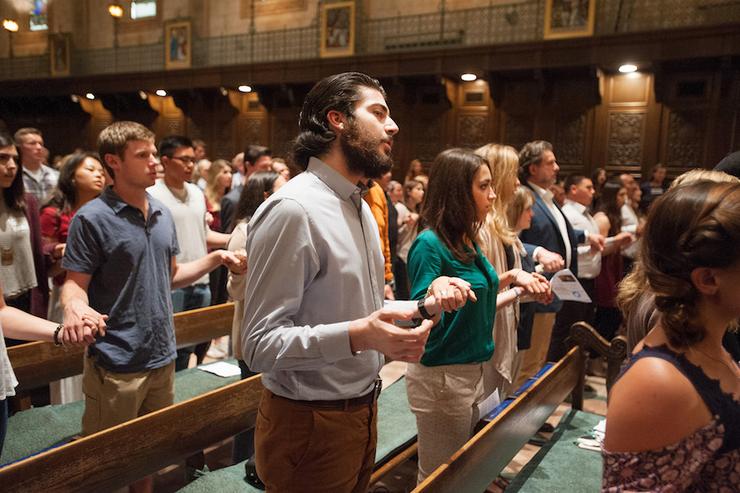 Students at mass in Founders Chapel