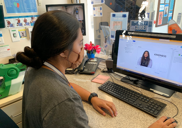 Photo of operations assistant Nicole taking the course on her computer
