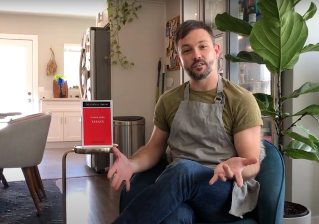 USD Professor Nick Riggle standing in front of kitchen stove