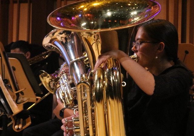 Wind Ensemble student playing a tuba in the Conrad