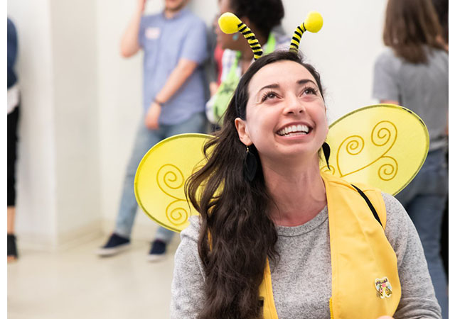 Jessica wears a bee costume.