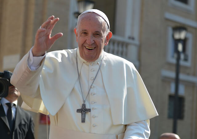Pope Francis standing and waving