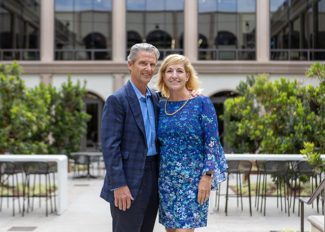 USD Board Chair Emeritus Donald Knauss and his wife, Ellie, pose in the courtyard of the Knauss Center for Business Education during the opening in August 2022. Knauss was just ranked #13 on the Wall Street Journal's May 2025 ranking of America’s top 250 corporate board directors.