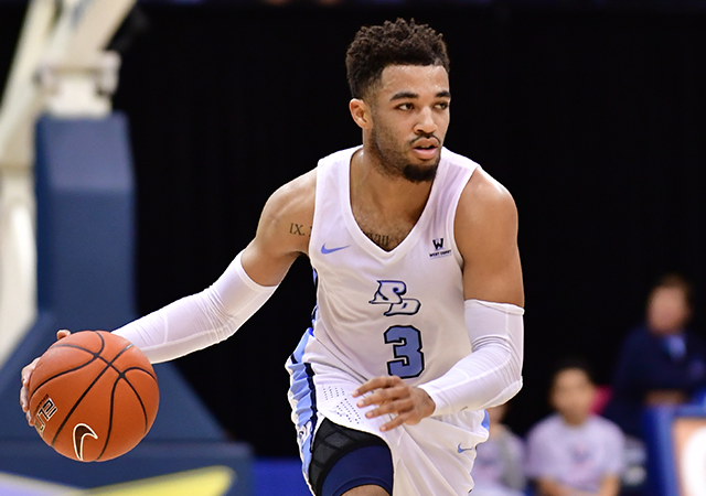 Olin Carter III dribbles