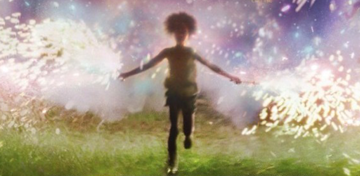 young child silhouette running with sparklers