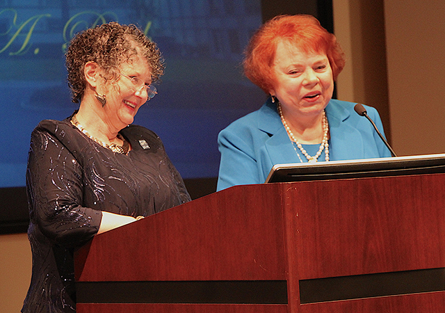 Hahn School of Nursing and Health Science Dean Jane Georges, left, and retired professor Dr. Patricia Roth enjoy a moment during the Feb. 20 Janet Rodgers Lectureship.