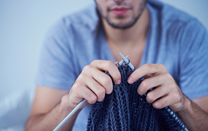 hands knitting with yarn