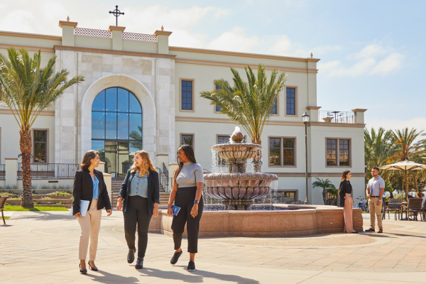 Students walking in front of Knauss School of Business