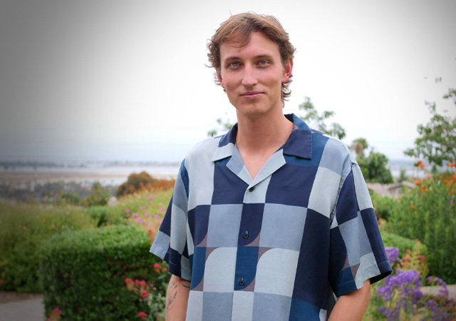 Photo of Gideon Sawyer standing in the IPJ Garden of the Sea