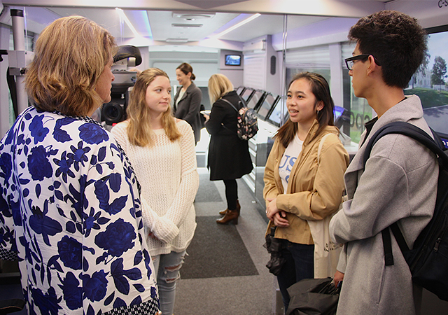CAS Dean Noelle Norton talks with students who were aboard the C-SPAN bus on Tuesday.