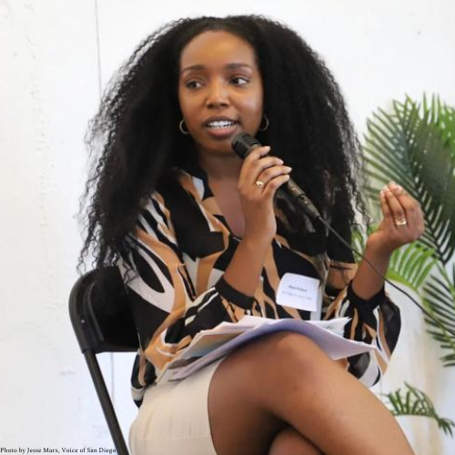 Khea Pollard woman sitting speaking into microphone