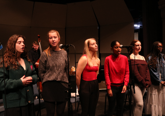USD Jazz Vocal Ensemble performing on stage.