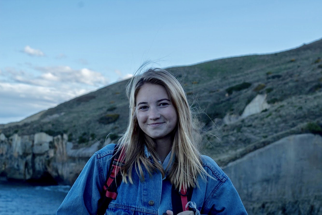 Headshot of Gabby with mountains in the background