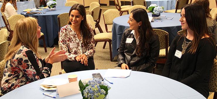 Students interact with USD 2011 alumna Allison Spalding, far left, during the USD Student Alumni Association's annual Take a Torero to Lunch event on April 4.