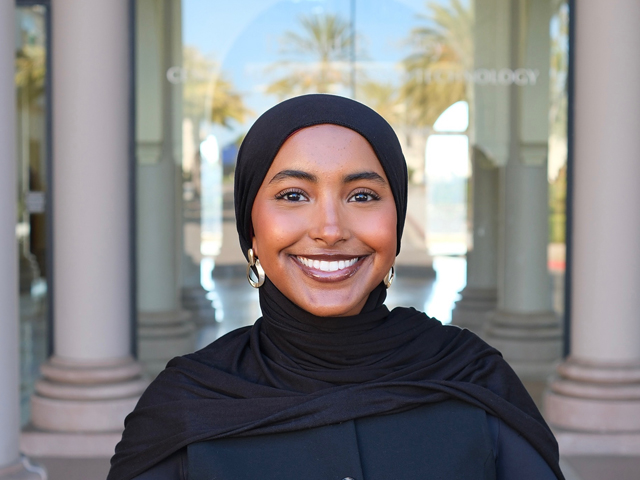 USD student Shukriya Osman smiling outside science building