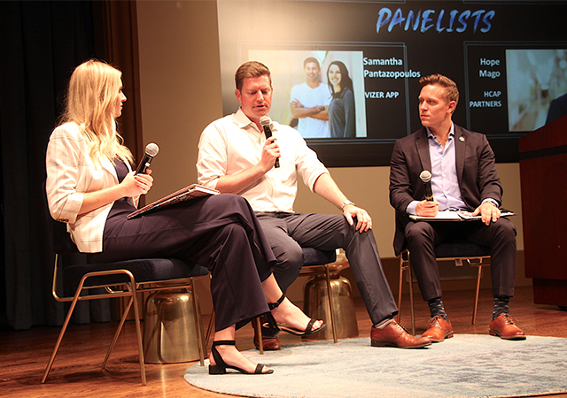 Curtis Chambers '19, center, speaks during the USD Entrepreneurship Legacy Conference on Sept. 26. He is flanked by two student interviewers.