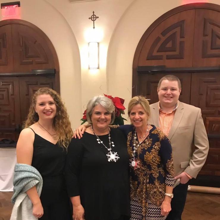 Four of The Nonprofit Institute's Team dressed up and smiling