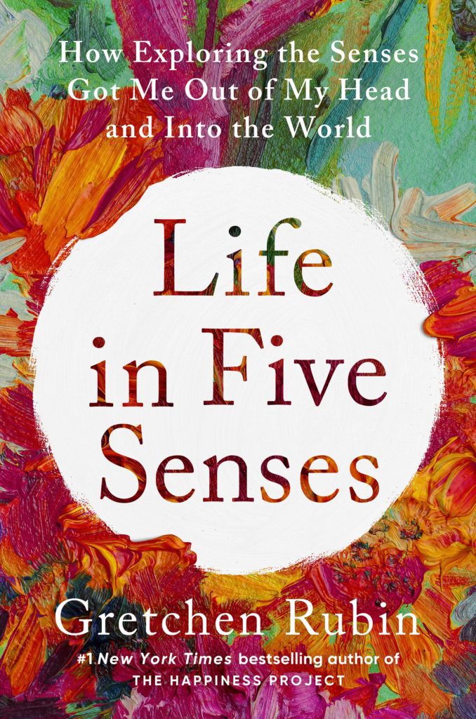 book cover which is a colorful paint pallet with a white center circle with title, Life in Five Senses.
