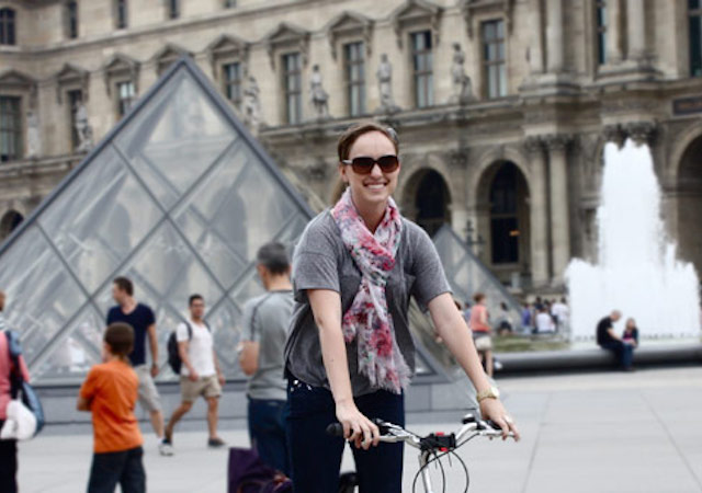 Student on a bike outside the Louvre