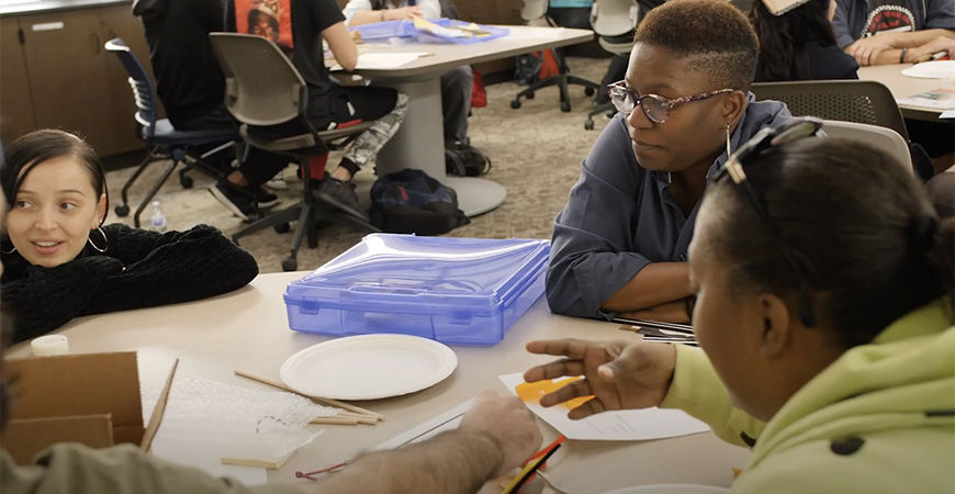 Students work with a member of the Blind Community Center during a Fall 2019 class meeting.
