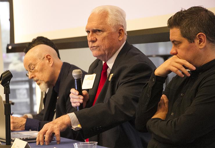 Dr. Gordon Romney, director of USD's Center for Cybersecurity, Engineering and Technology, makes a point during a panel discussion.