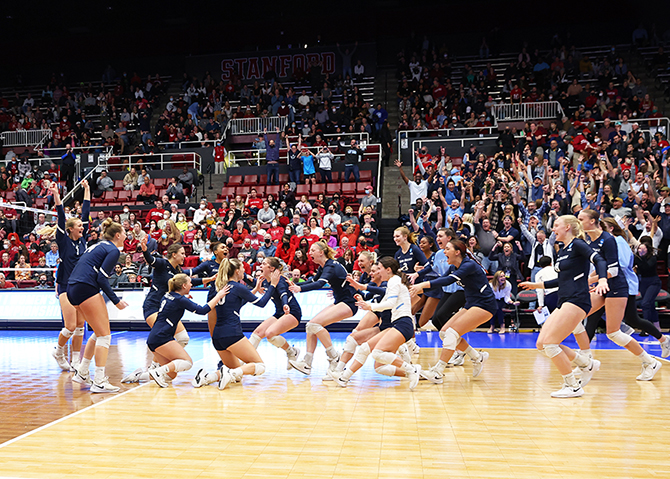 USD volleyball team celebrates win