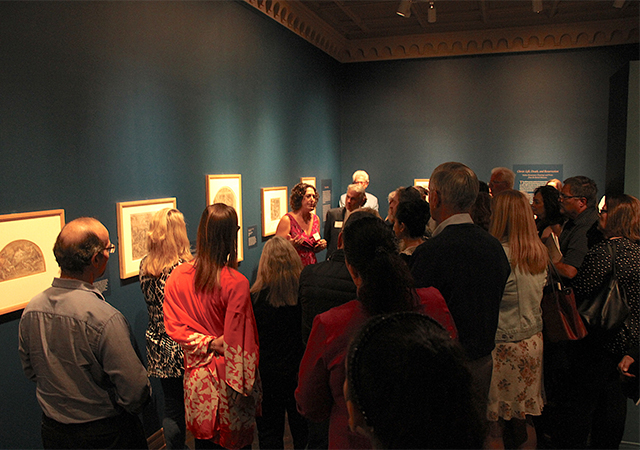 Kate Dimitrova, a USD art history lecturer, gives a tour of the