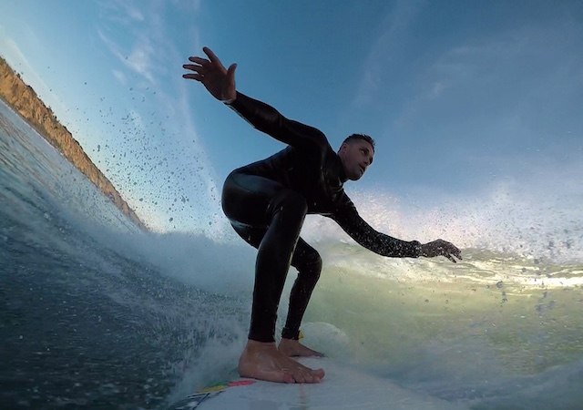 man surfing on a surfboard
