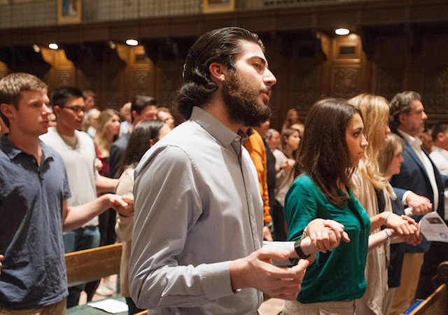 Students at mass in Founders Chapel