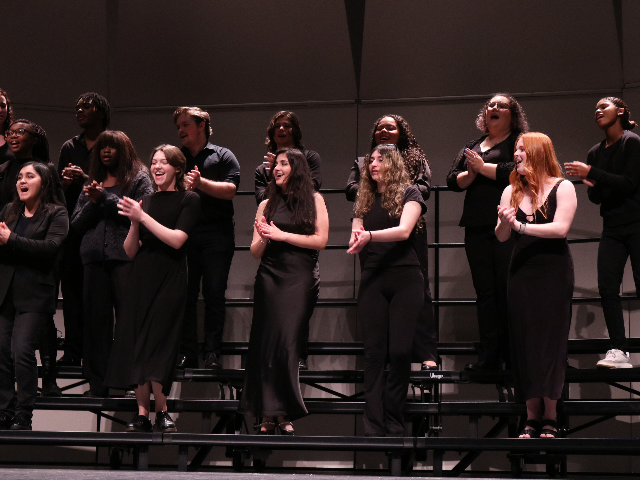 Gospel Choir students performing on stage in the Shiley Theatre.