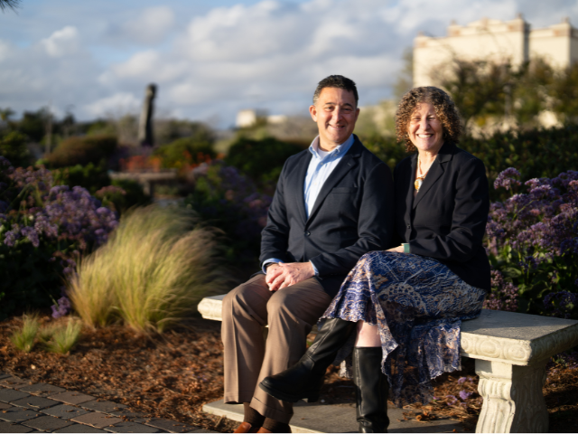 perla and jeff myers sitting on a bench in the garden of the sea at USD