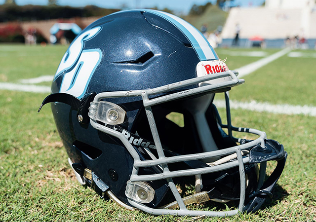USD Football helmet on the field