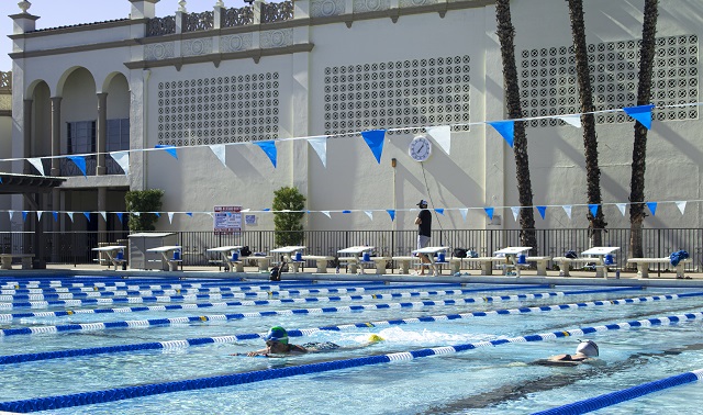 Photo of swimmers and staff in and around the Sports Center pool