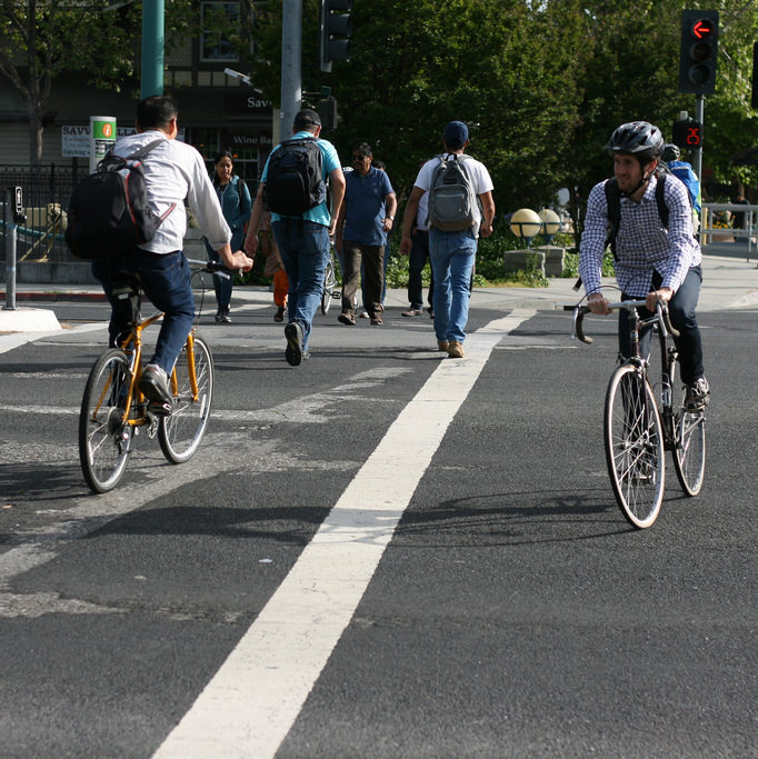 people riding bicycles