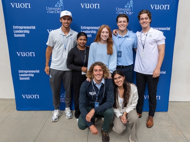 USD students pose in front of ELS backdrop