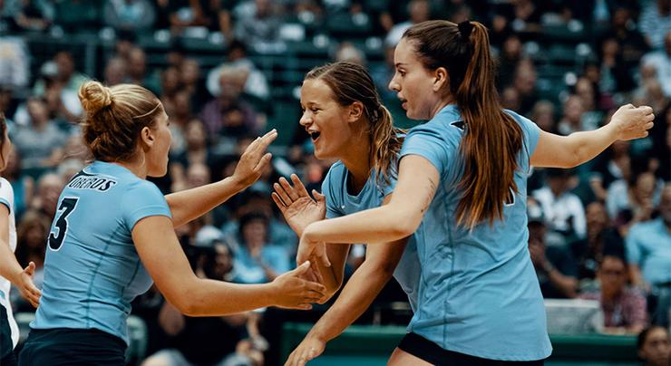 USD volleyball's Megan Jacobsen sends a ball over the net.