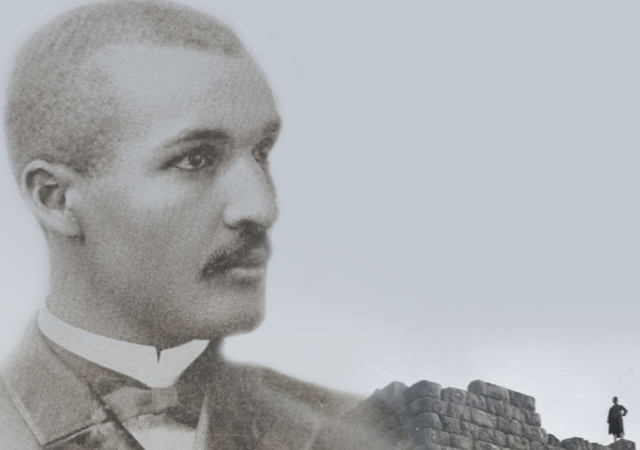 black and white headshot of John Wesley Gilbert looking to the side in a suit
