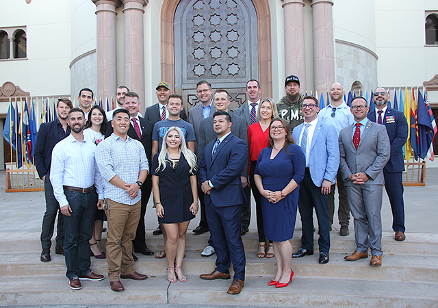 Student, staff and alumni veterans present for USD's Veterans Day celebration on Nov. 8 pose for a group photo.