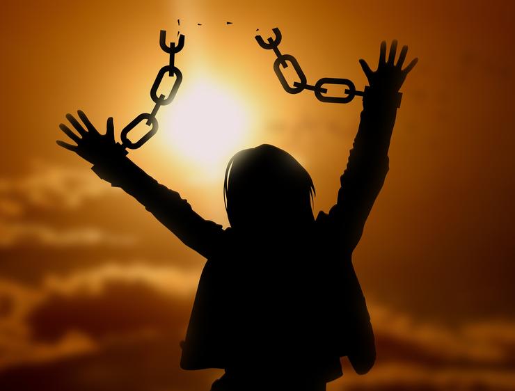 A woman breaks her chains.