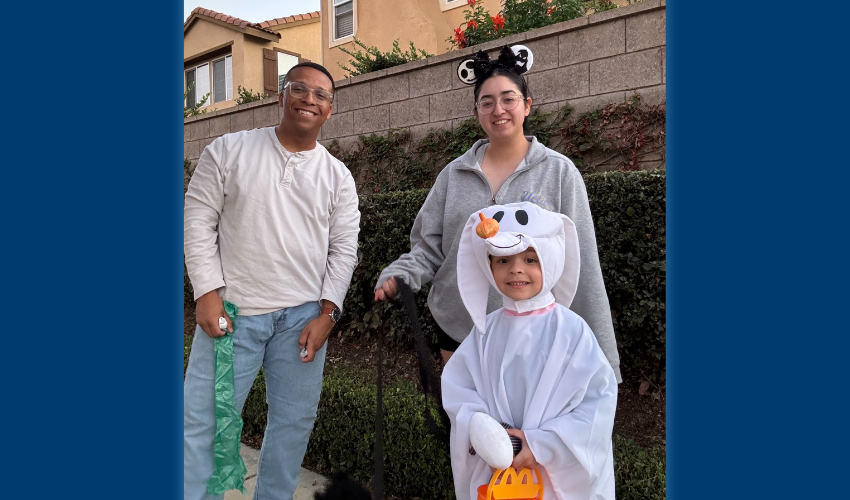 USD student veteran Jack Atkinson poses with his mother for a photo while wearing his U.S. Navy uniform.