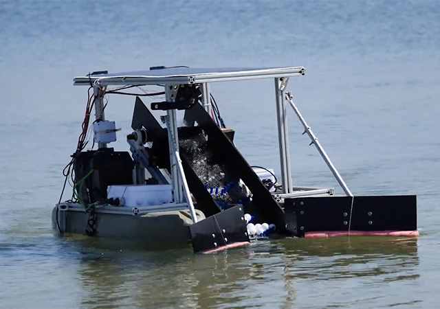 FRED, Floating Robot to Eliminate Debris, moves around in Mission Bay during a demonstration on the water.