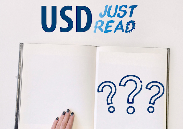 Image of open book that has 3 large questions marks. Above reads "USD Just Read!"