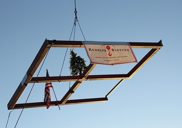 A top beam for the Learning Commons building goes up in the air after USD campus community members had the chance to sign a message. The Learning Commons is expected to open in Fall 2020.