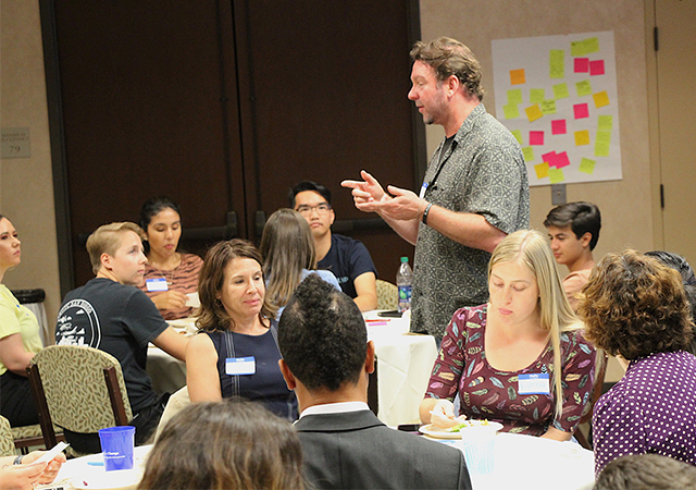 Professor Mike Williams speaks to campus community members who attended a Homelessness and Food Insecurity Week event on Thursday night.